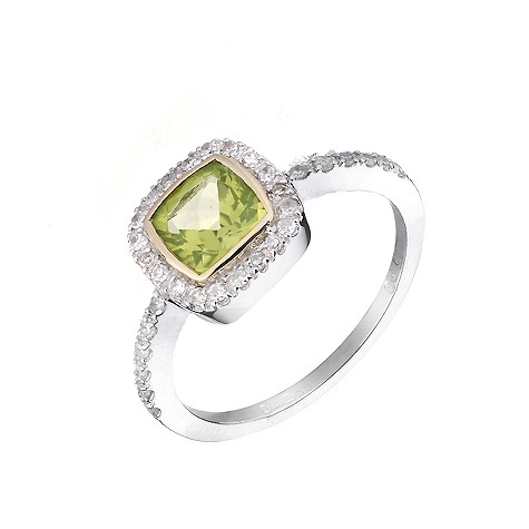 A large peridot nestled in a bed of diamonds